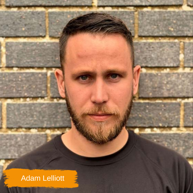 Adam Lelliott, a Your PT Personal Trainer, pictured against a black wall at Worthing Leisure Centre